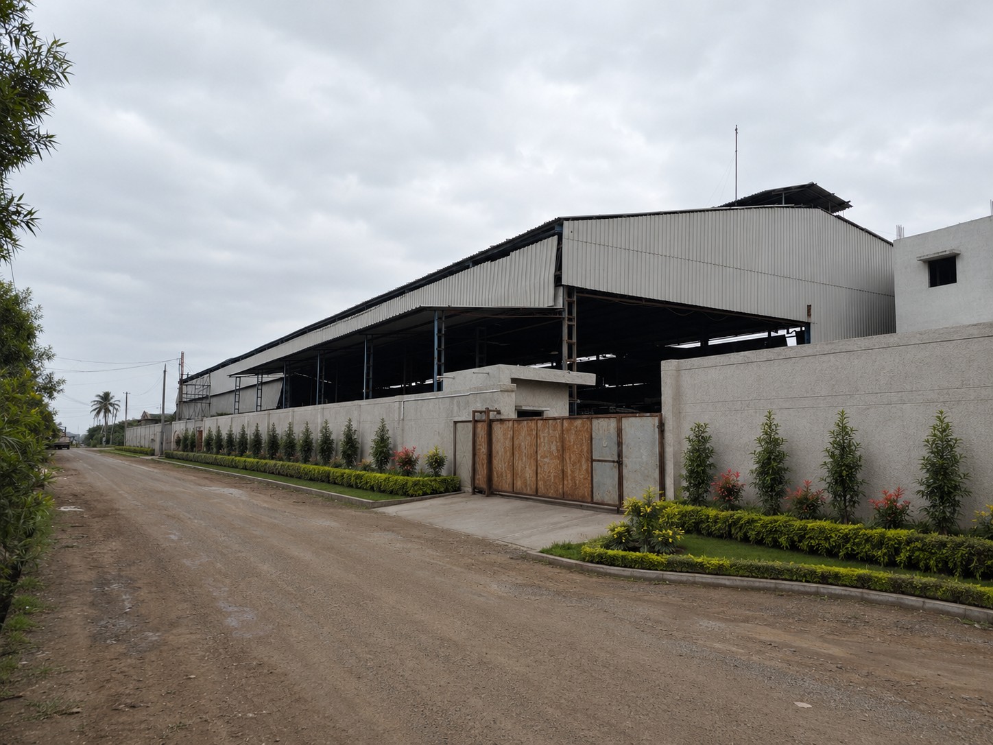 Janki Stainless manufacturing plant, Dholka — entrance gate and boundary wall
